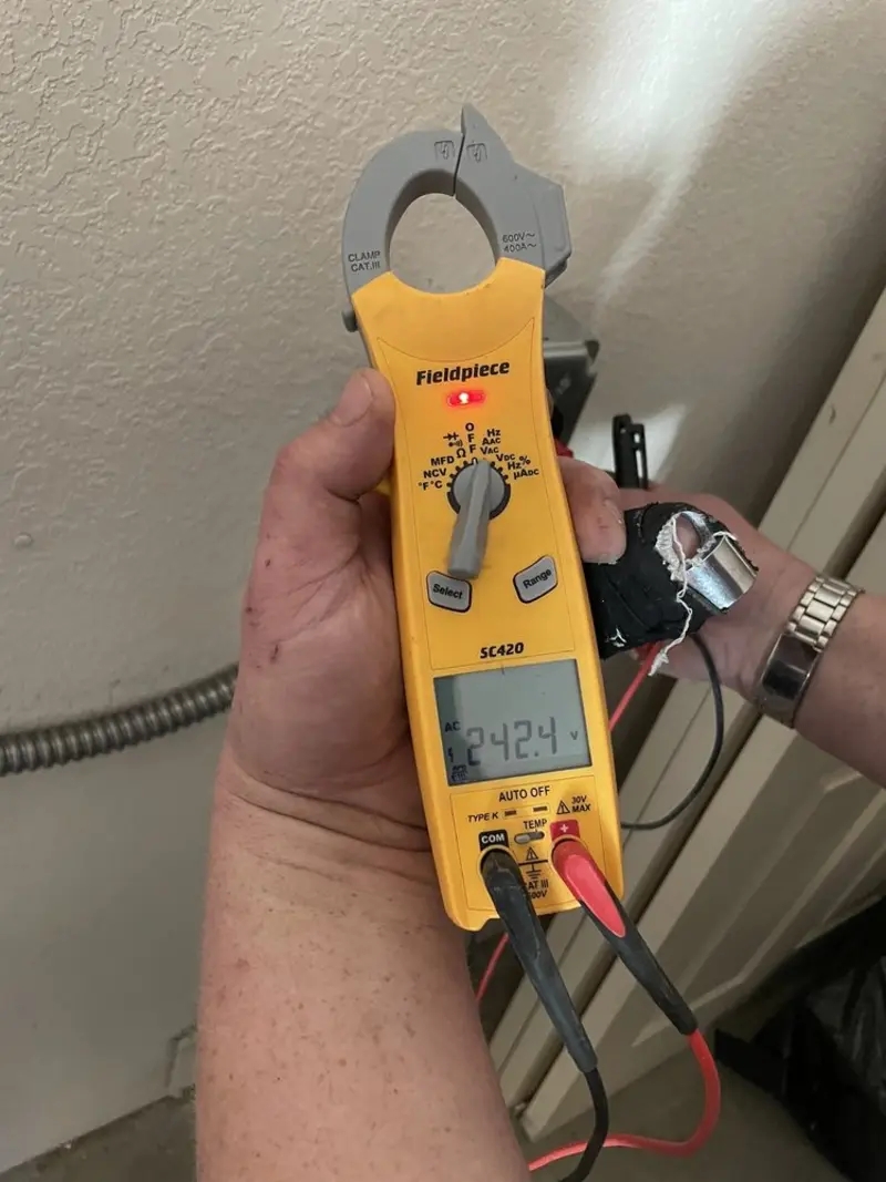 Voltage testing with clamp meter during Outlet Installation in Canton